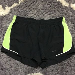 Black and green Nike Dri-Fit shorts